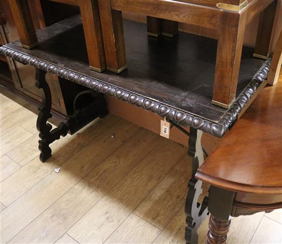 A Spanish stained walnut centre table W.118cm
